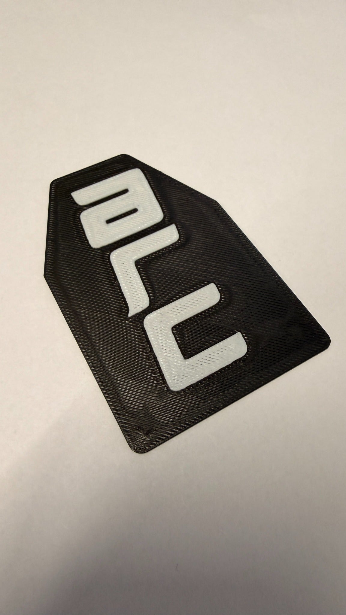 Black and white custom branded NFC card example from another angle