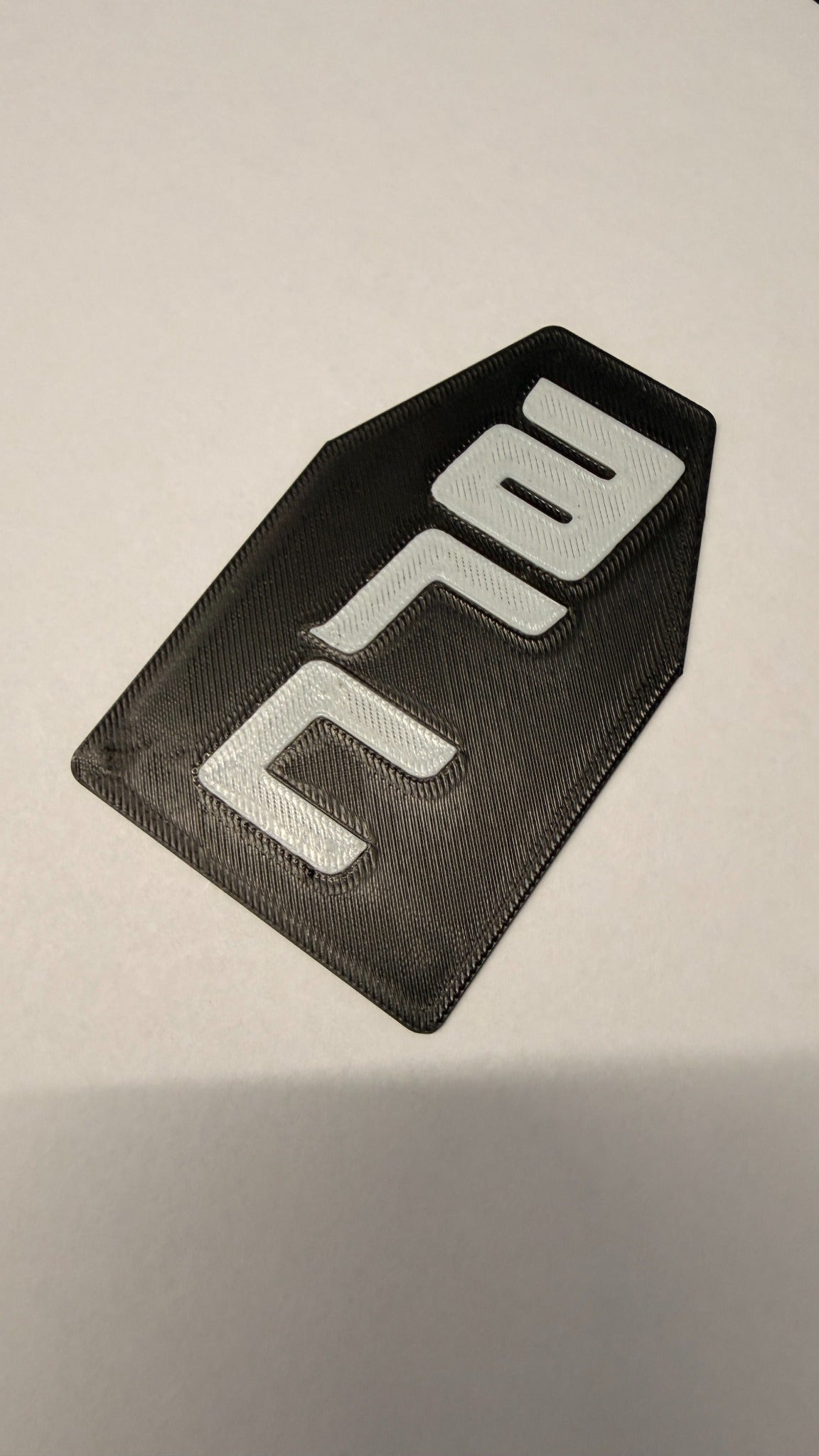Black and white custom branded NFC card close-up