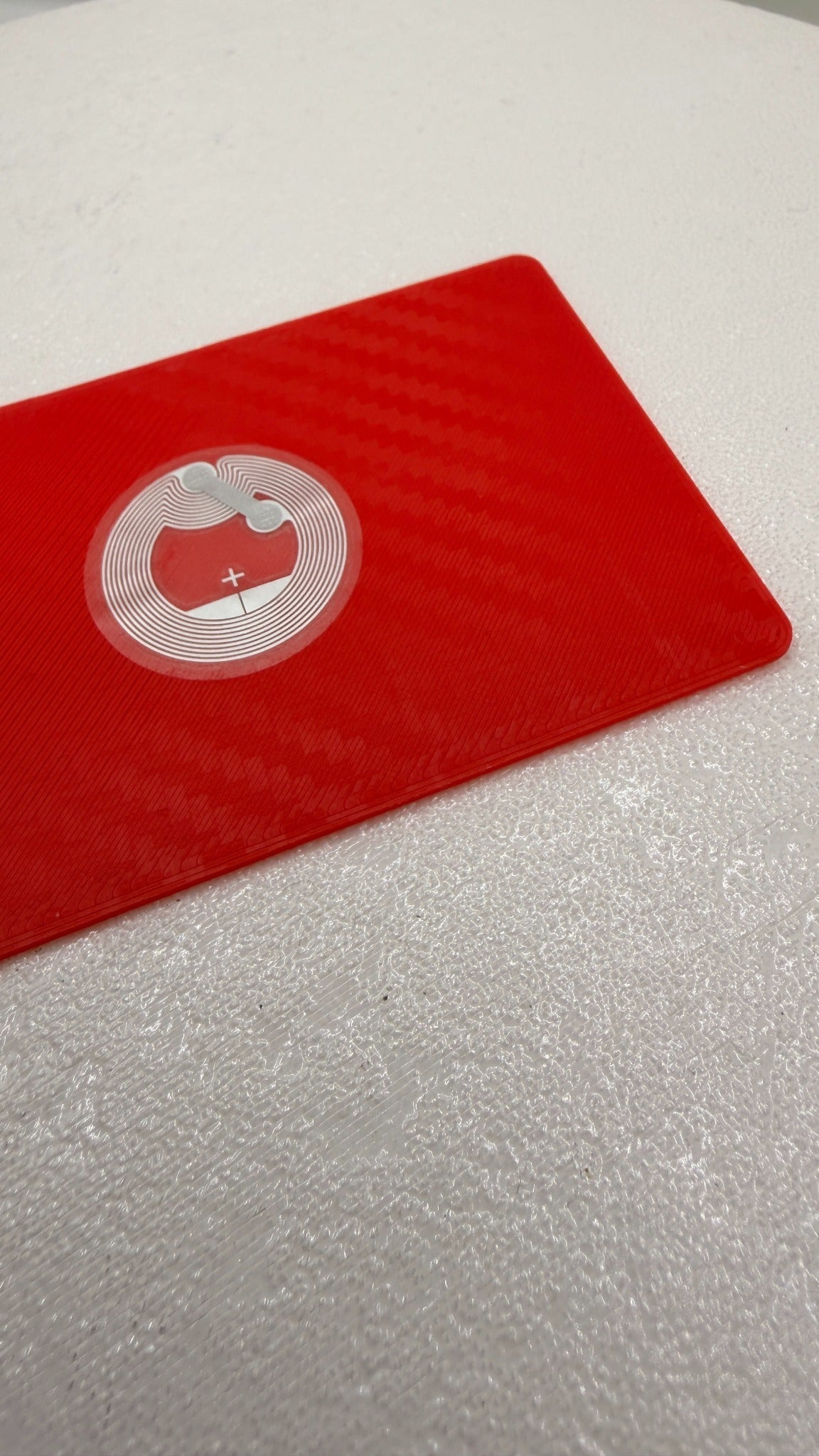 Red custom NFC business card showing embedded NFC tag