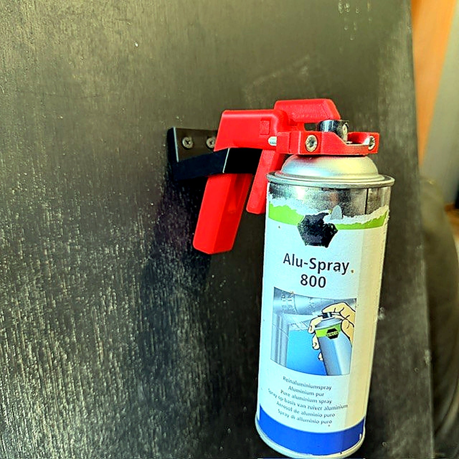 Adjustable aerosol trigger handle and aerosol can mounted in Wards Additive wall holder
